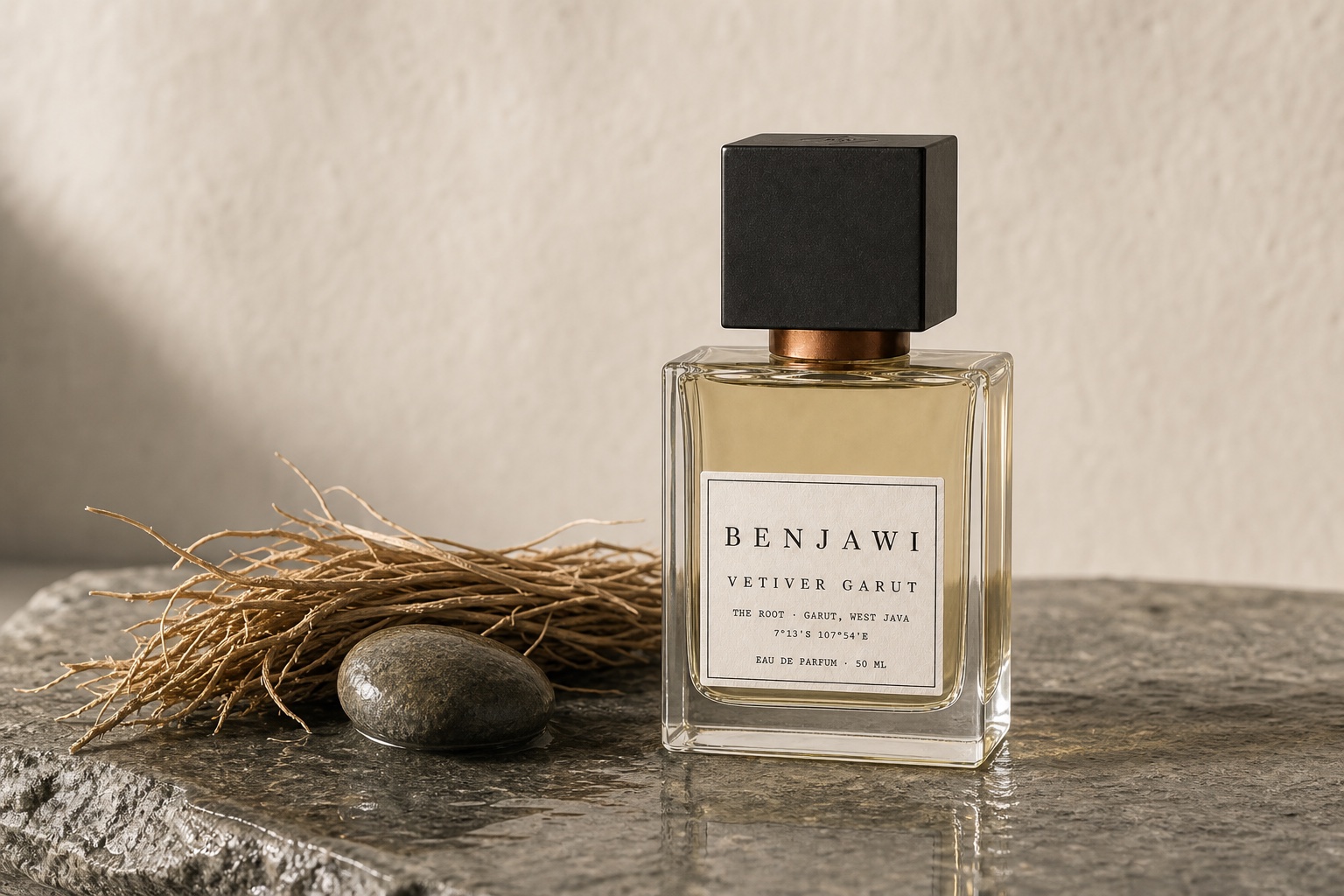 Vetiver Garut fragrance beside dried vetiver roots and a wet river stone