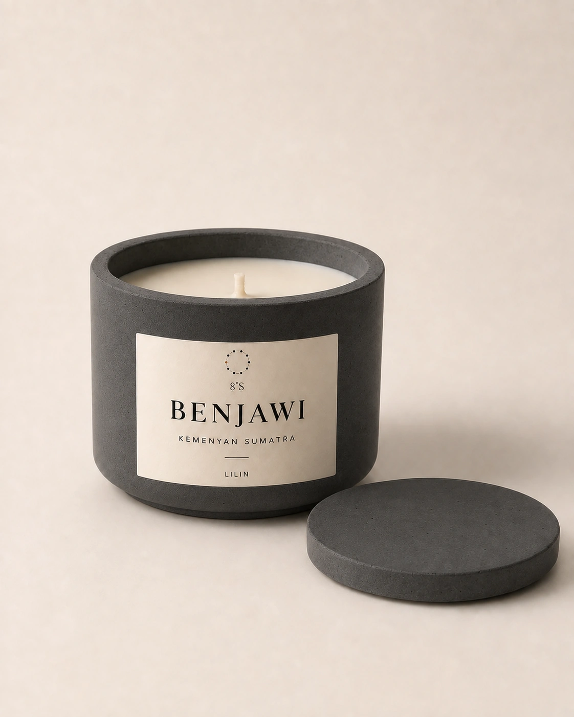 Kemenyan Sumatra candle in a round charcoal concrete vessel, with its matching concrete lid alongside.