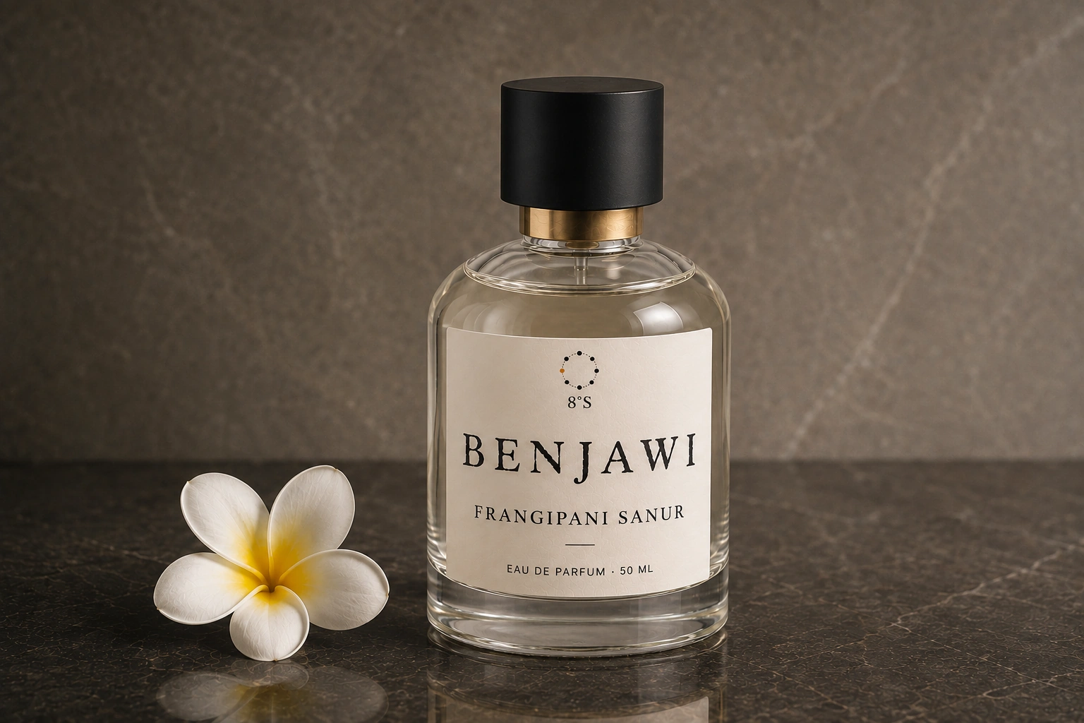 Round Frangipani Sanur fragrance bottle beside one white frangipani flower on dark stone