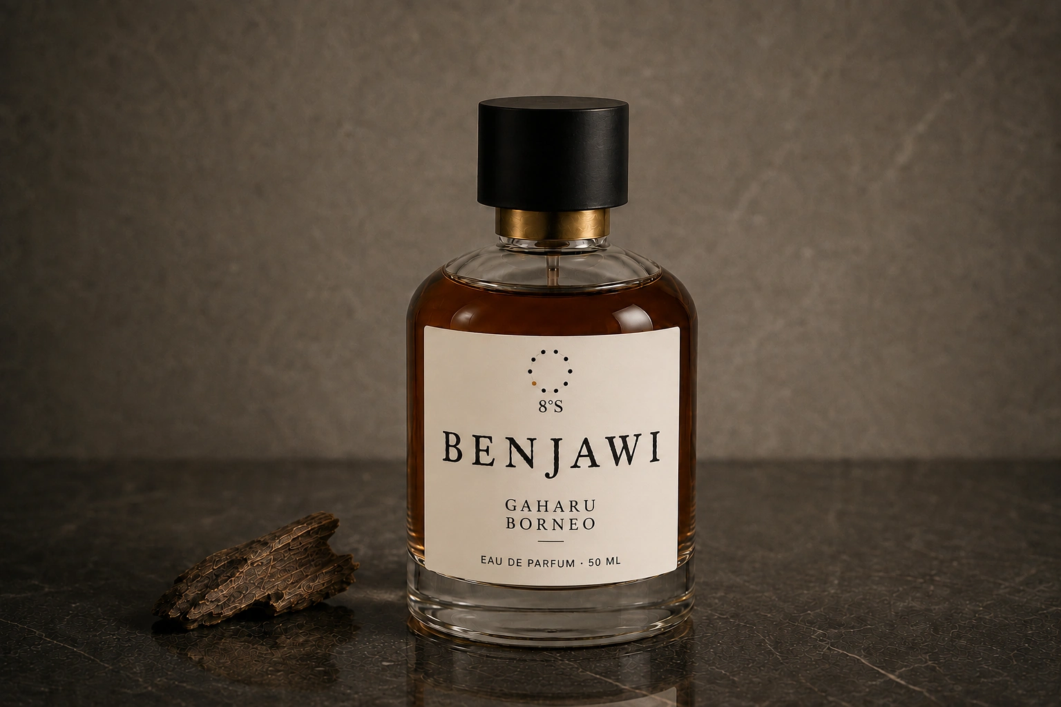 Gaharu Borneo fragrance beside one piece of dark agarwood on mineral stone
