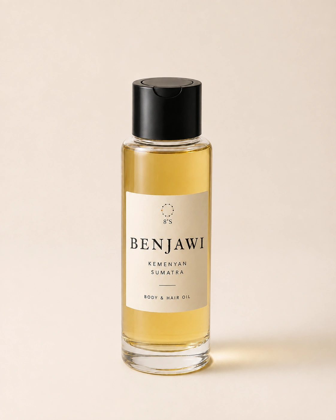 Benjawi Kemenyan Sumatra body and hair oil in a slender round glass bottle with a black dispensing cap